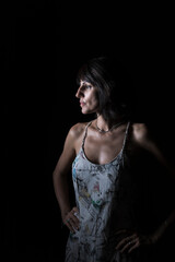 Naklejka premium young woman with black hair on black background