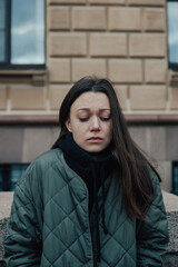 portrait of crying young woman on the street