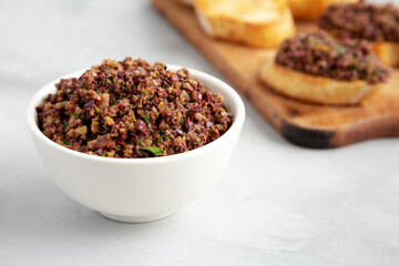 Homemade Mixed Olive Tapenade in a Bowl, side view.
