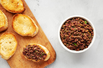Homemade Mixed Olive Tapenade Appetizer in a Bowl, top view. Flat lay, overhead, from above.
