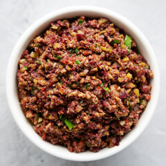 Homemade Mixed Olive Tapenade Appetizer in a Bowl, top view. Flat lay, overhead, from above.