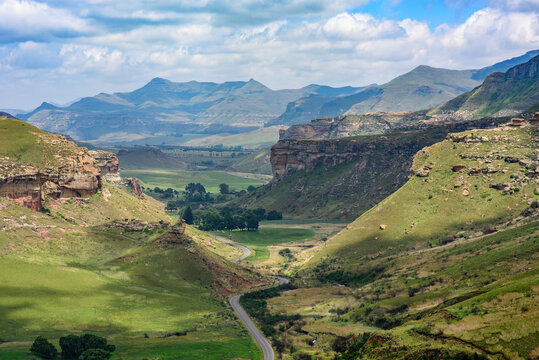 Looking down on a road winding through the valley in Golden Gate Highlands National Park. Viewed from the top of the Brandwag Buttress (Sentinel) rock near Clarens, South Africa