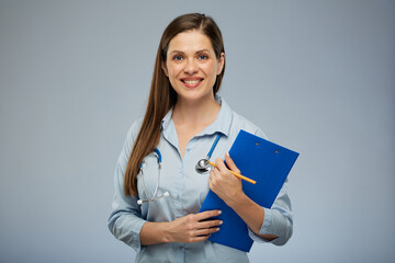 Doctor woman in medical uniform holding clipboard with health insurance. Isolated portrait of female medical worker