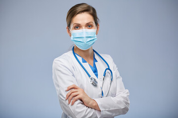 Doctor woman wearing blue medical mask isolated portrait.