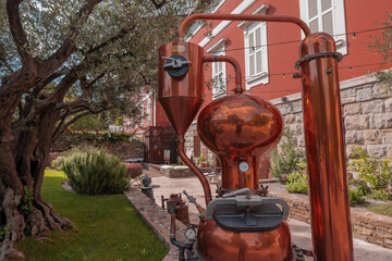 Schnaps distillery, display of kettle, boiler etc in brass material. Fancy distillery. - obrazy, fototapety, plakaty