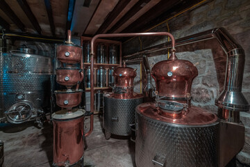 Schnaps distillery, display of kettle, boiler etc in brass material. Fancy distillery. - obrazy, fototapety, plakaty