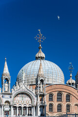 Fototapeta na wymiar The Saint Mark's Basilica is the cathedral of Venice, in Italo-Byzantine architecture. It is symbol of Venetian wealth and power, since 11th century it known as Church of Gold. Italy, 2019