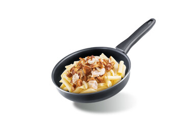 Chanterelle onion fried creamy pasta in a pan on a white isolated background
