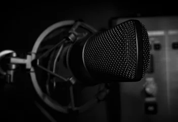 Deurstickers microphone on a black background © reznik_val