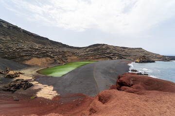 Coastal lagoon El Charco Verde. View from Mirador del Charco de los Clicos. Lanzarote. Canary Islands. Spain.