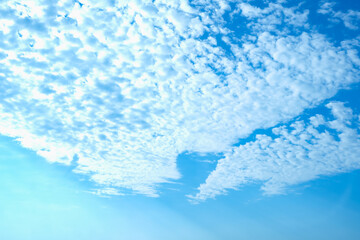 Blue sky with white clouds. Beautiful cloudy sky. Skyward. Endless skyline. The sky at dawn.