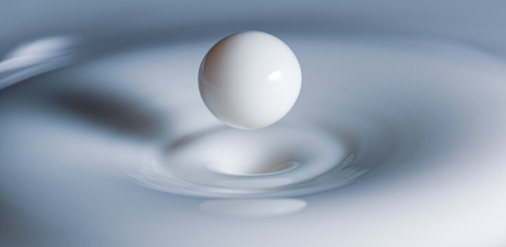 Closeup Of Milk-drop Bouncing Back After Hitting Milky Surface 