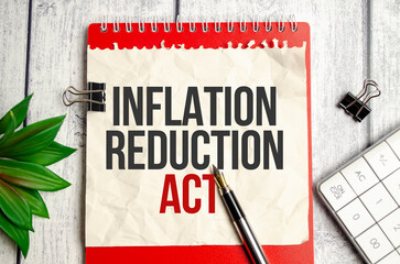 Text INFLATION REDUCTION ACT text written on red notepad