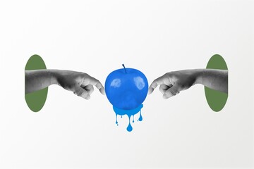 Two hands touch a blue apple