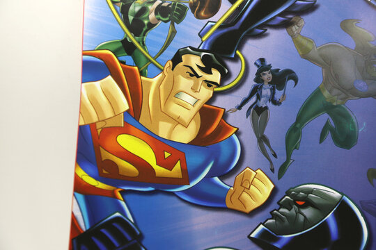 Comic magazine of Superman and The Justice League. Superman in action. Superhero illustration. Fight of good against evil. Superman angry and fighting.