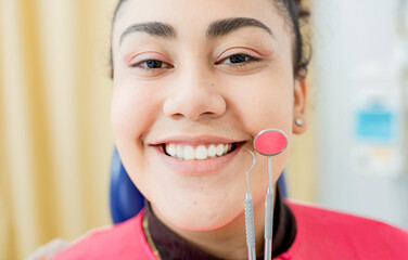 Dental smile young woman with dentist tools. Patient with perfect smile with dental explorer and...