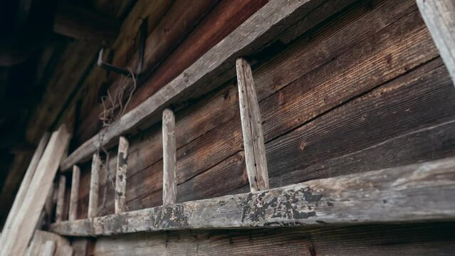 Wooden historic ladder. Old ukrainian hutsul house. Authentic eco-living of shepherd in herd koliba village