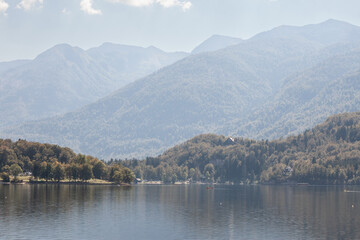 Panorama of Lake Bohinj, also called bohinjsko jezero, on a sunny afternoon. Bohinj lake is a major landmark of the Julian Alps mountain chain in Slovenia, Europe.....