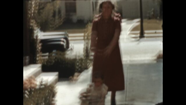 Baby in a Stroller 1940 - Grandma pushes her granddaughter in a Taylor Tot stroller in Los Angeles, California in 1940. 