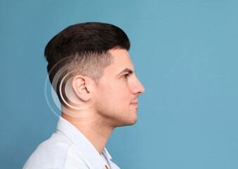 Obraz premium Hearing loss concept. Man and sound waves illustration on light blue background