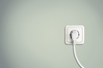 Classic white socket with plug on colored wall,