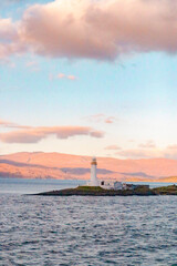 Fototapeta na wymiar lighthouse at sunset in the sea