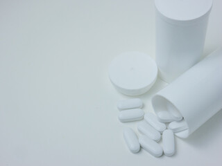 white pill on wood table for sci or medical concept