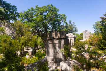 Fototapeta na wymiar Territory of the North-eastern necropolis with a view of the ancient sarcophagi in the city of Termessos, currently located ..near Antalya, Turkey