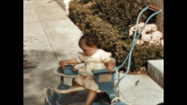 Taylor Tot Stroller 1940 - A young child sits in a Taylor Tot stroller in Los Angeles, California in 1940. 