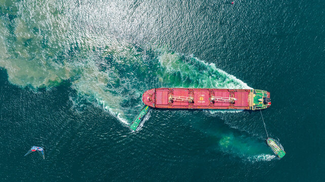 Tug Boat drag Barge ship carry Metal steel pipe construction unit , No International Sewage sludge Pollution Prevention Certificate, Sewage Sludge in the sea made by Activity of ship concept