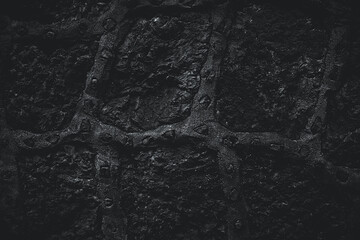 Black texture. Stone background. Dark marble. Rock texture. Rock surface with cracks. Rock pile. Paint spots wall. Grunge Rough structure. Abstract texture.