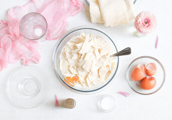 Step 4. Mixing eggs with cottage cheese, milk, grated cheese and chopped pita bread.