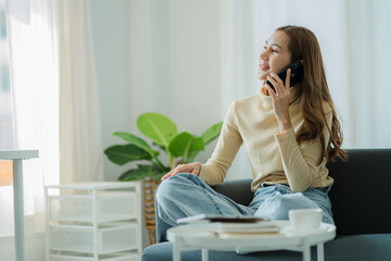 Asian women use smartphones and computers using technology, work at home using apps. Shopping online, reading news, surfing the internet