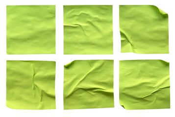A set of blank fluorescent green rectangular paper glued crumpled and creased note memo isolated on...