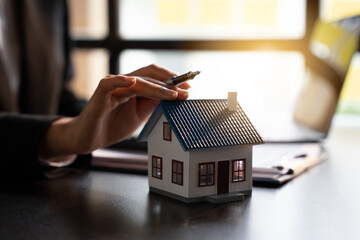 Sale Estate agent are presenting home loan to customer and discussing for contract to buy, get insurance or loan real estate or property, property price concept.