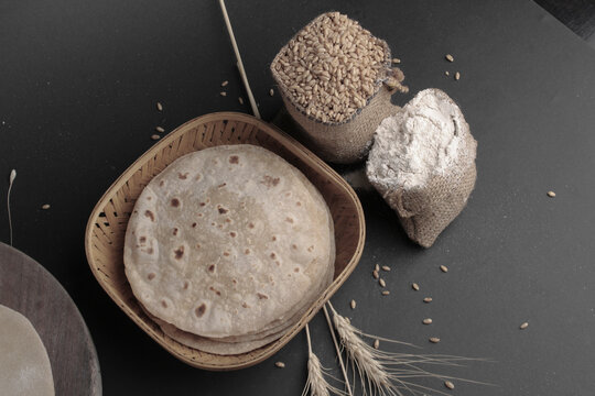 Rustic shot of a plate of chapati surrounded by ingredients