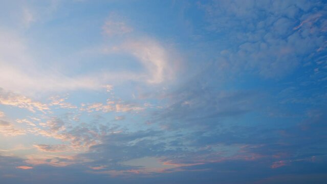 Sunbeam shining through sunset sky in summer sunshine evening. Beautiful sky with cirrocumulus clouds background. Timelapse.