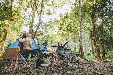 Group of girl friends enjoy with camping in park together