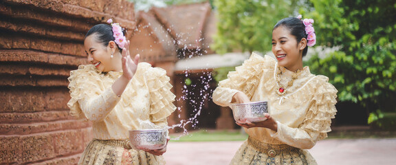 Portrait beautiful women in Songkran festival with Thai Traditional costume