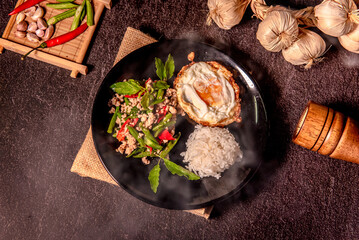 Papaya salad in white dish (Thai called Som tam) on fresh banana leaf, Choose focus and free space for message.