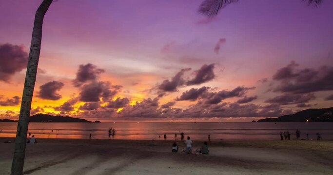 4K Time lapse of sunset at tropical sea beach landscape light of nature cloudscape sky and Clouds moving .Nature environment background