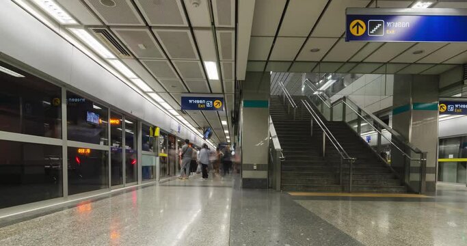 Timelapse in subway platform train station in rush hour with crowded passenger in city