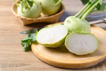 Fresh kohlrabi cutting on wooden board prepare for cooking