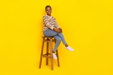 Full body photo of lovely cute person sit chair have good mood toothy smile isolated on yellow...