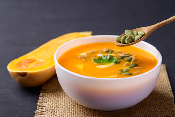 Butternut squash pumpkin soup in bowl, Homemade food in autumn season