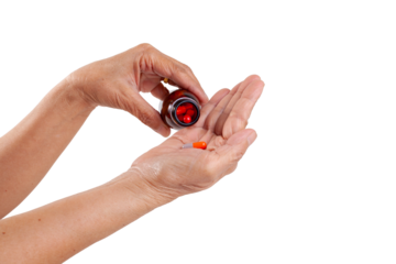 hand holding pills bottle
