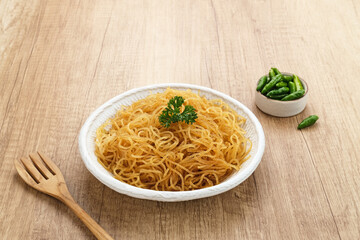 Bihun Goreng or Fried Vermicelli Noodle, traditional Indonesian culinary food. 
