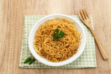 Bihun Goreng or Fried Vermicelli Noodle, traditional Indonesian culinary food. 

