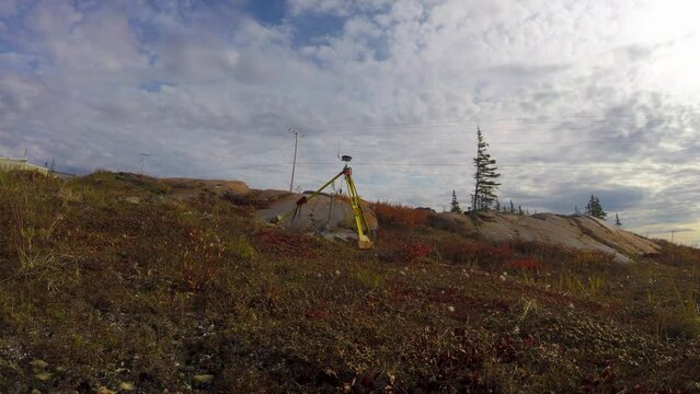 Time lapse of Leica GNSS GPS surveyor base station on tundra near Churchill Manitoba Northern Canada in summer