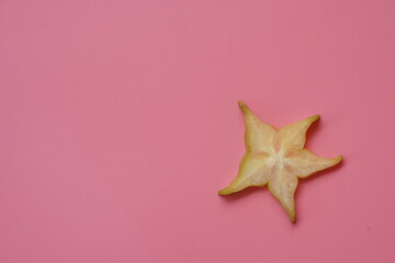 red star fruit on a wooden background